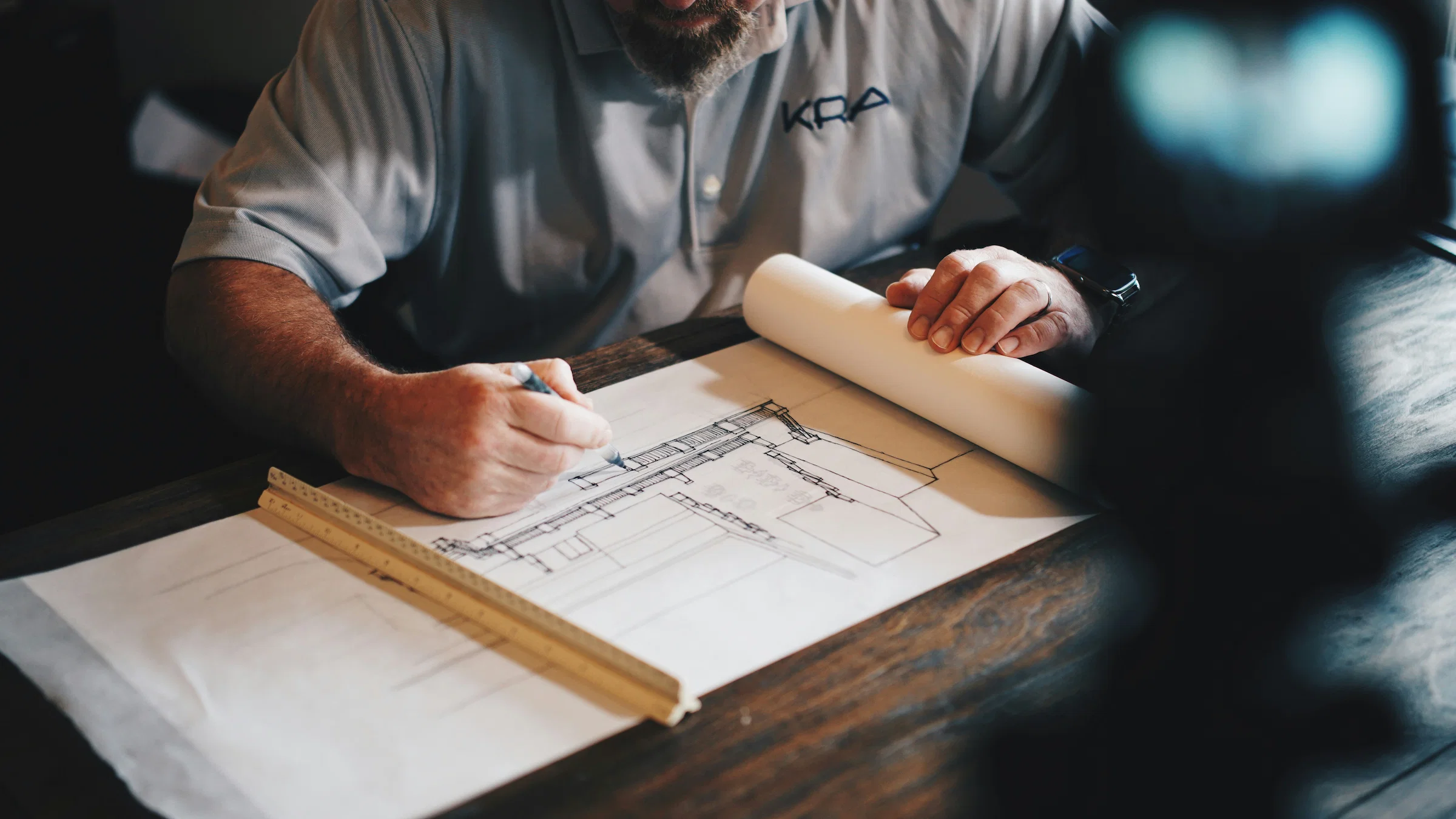 Tradesperson reviewing a written job agreement with a customer